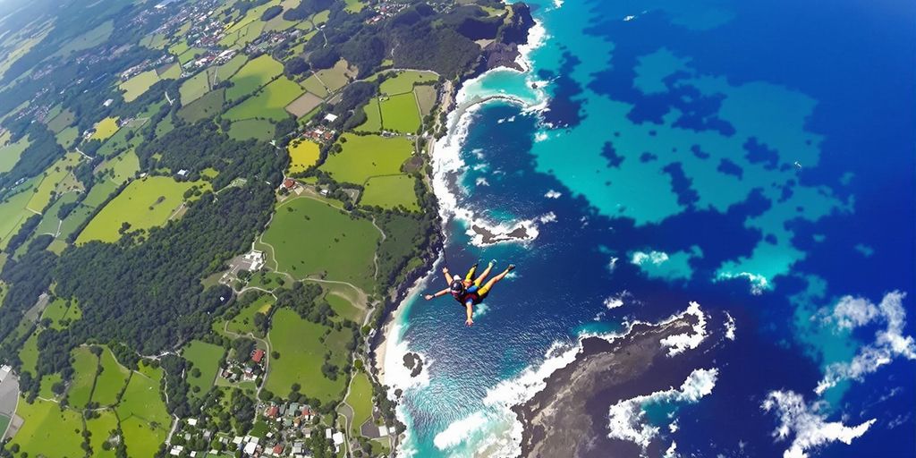 Skydiver soaring over Bali's picturesque coastline.